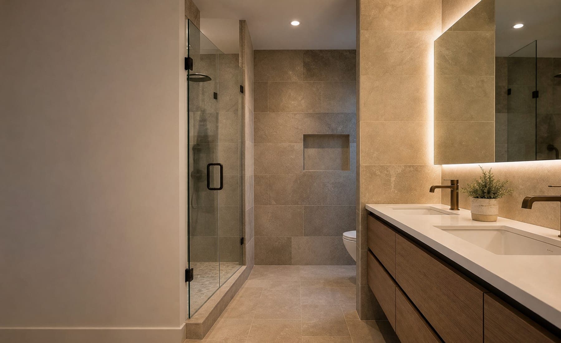 Finished bathroom remodel with warm tile, glass shower, and wood vanity