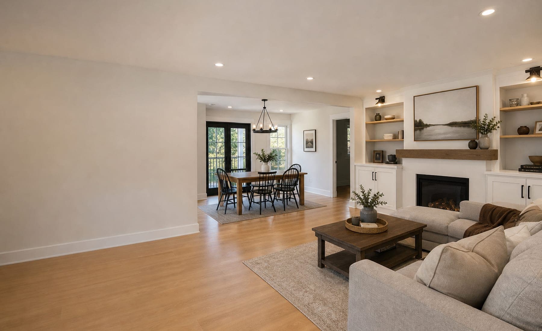 Finished open interior renovation with warm wood floors and clean trim